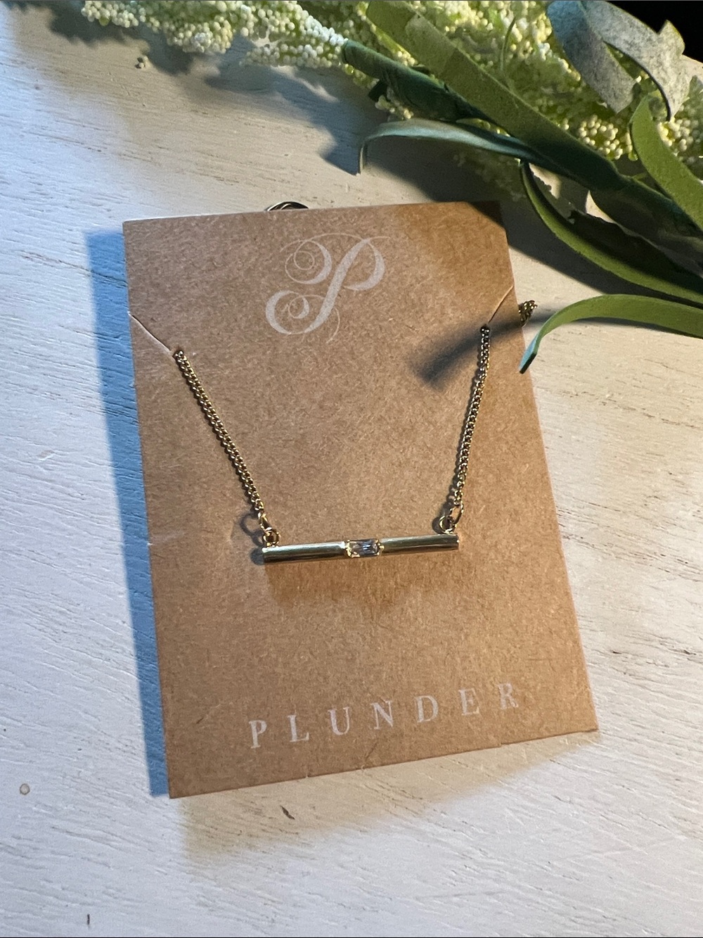 Plunder gold tone bar necklace